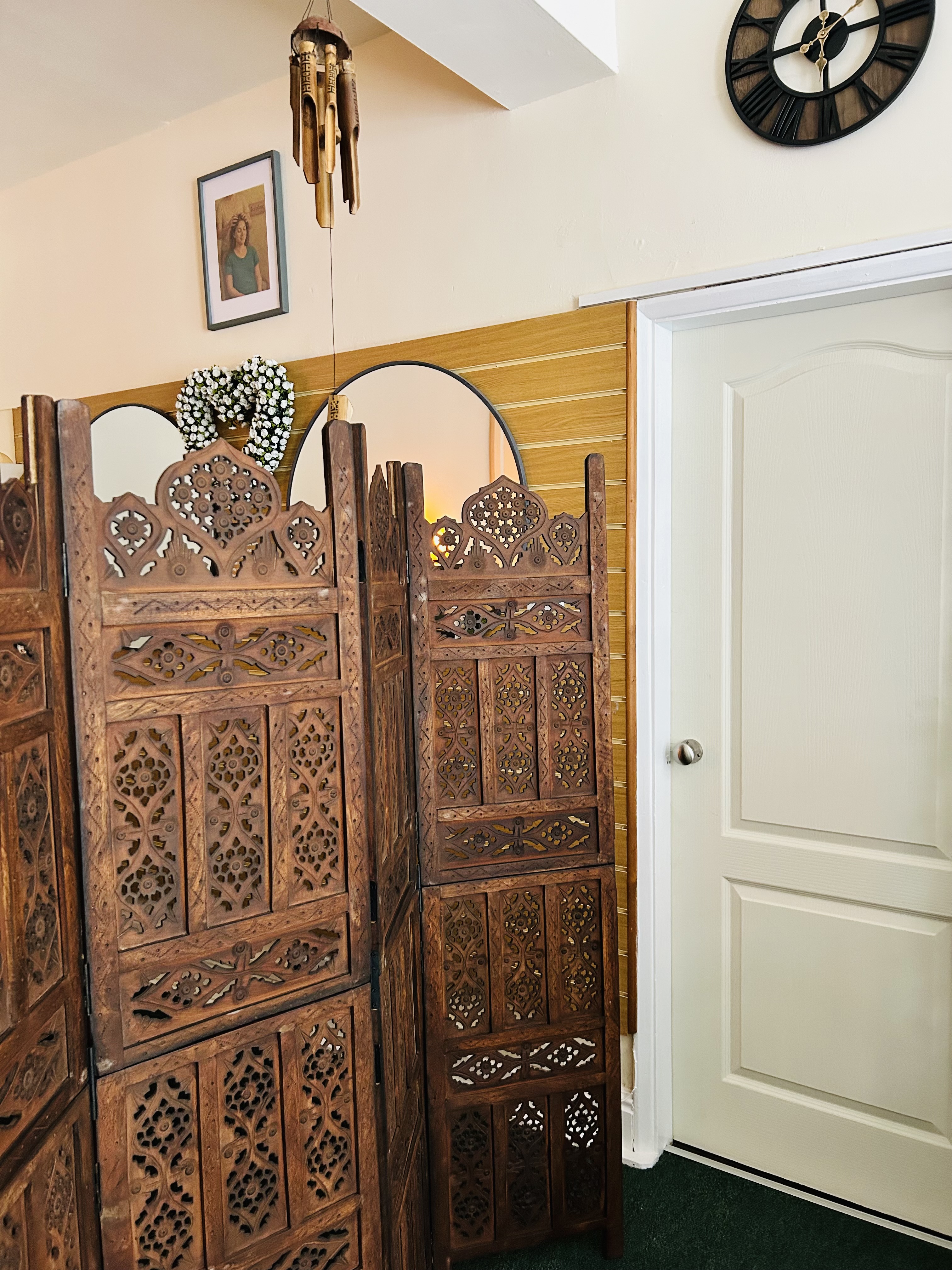 Wooden screen and wall clock