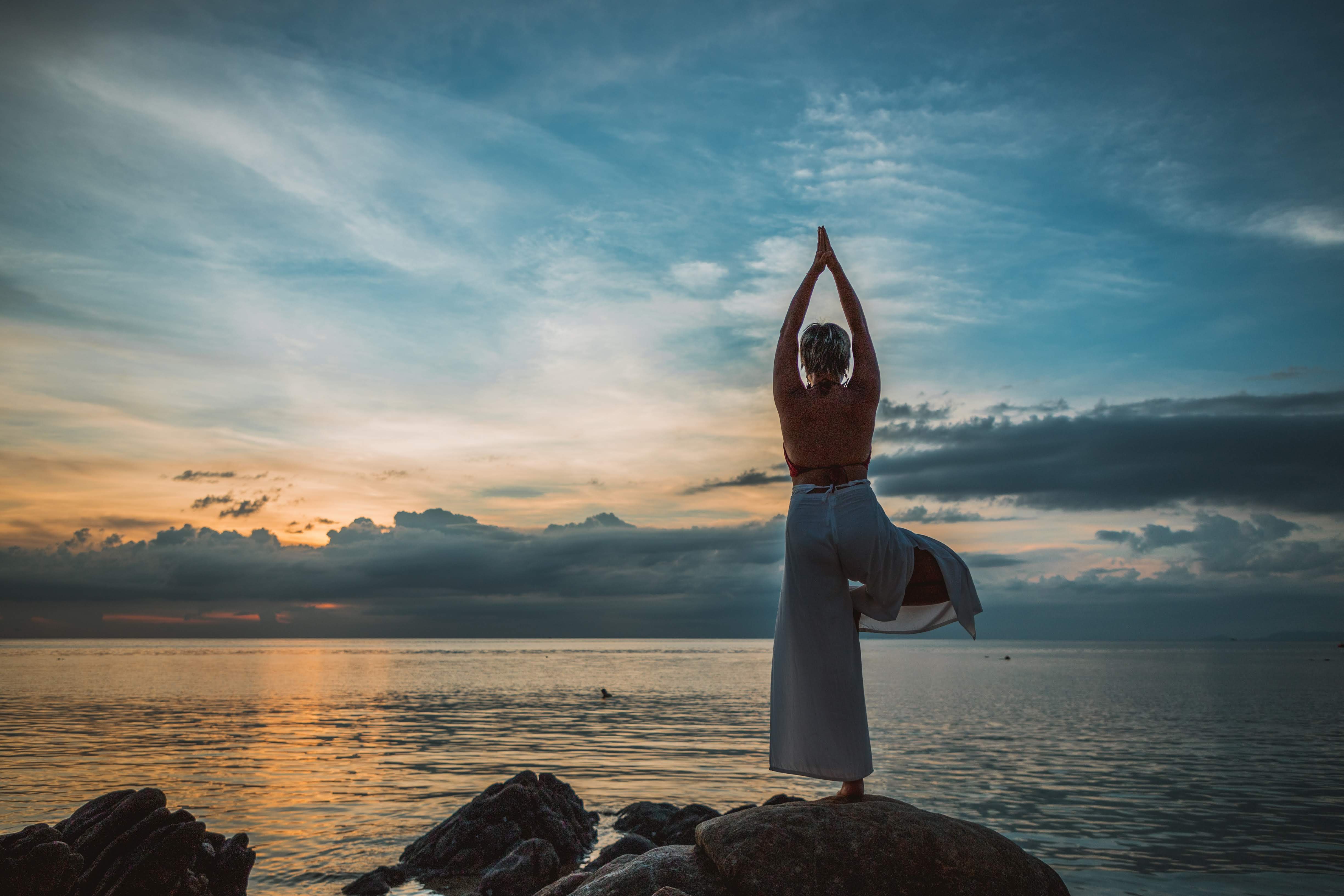 Sunset yoga by the sea